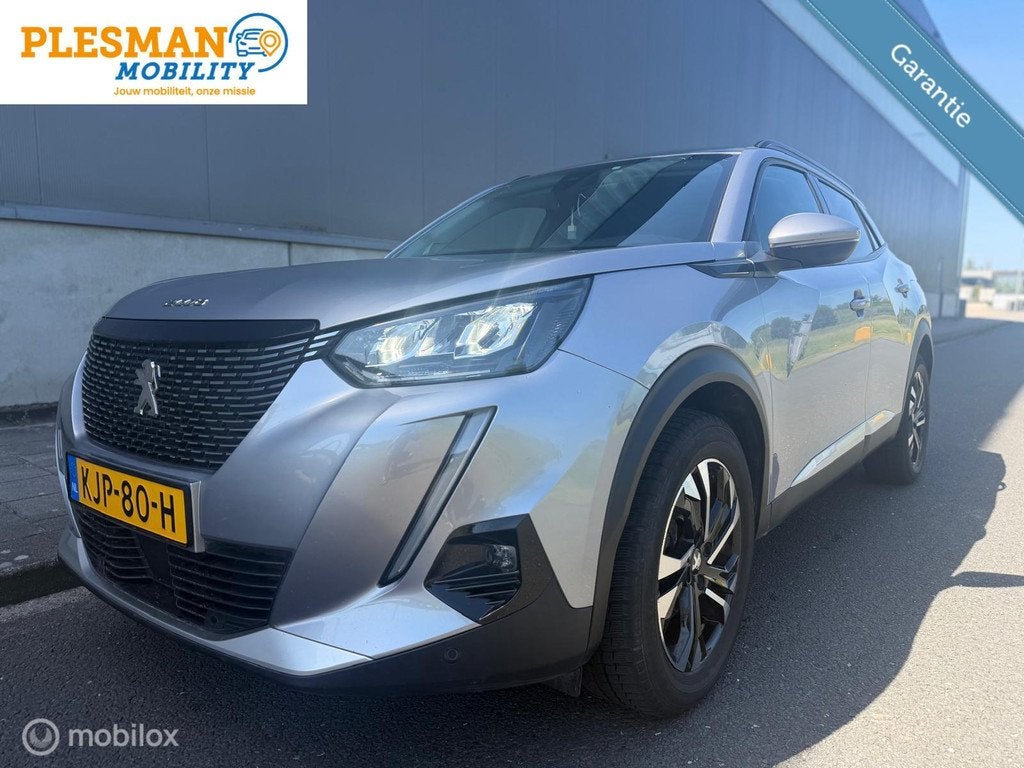 Peugeot 2008 1.2 PureTech Allure Automaat, Garantie!, Gebruikt, Euro 6, 1199 cc, Leder en Stof