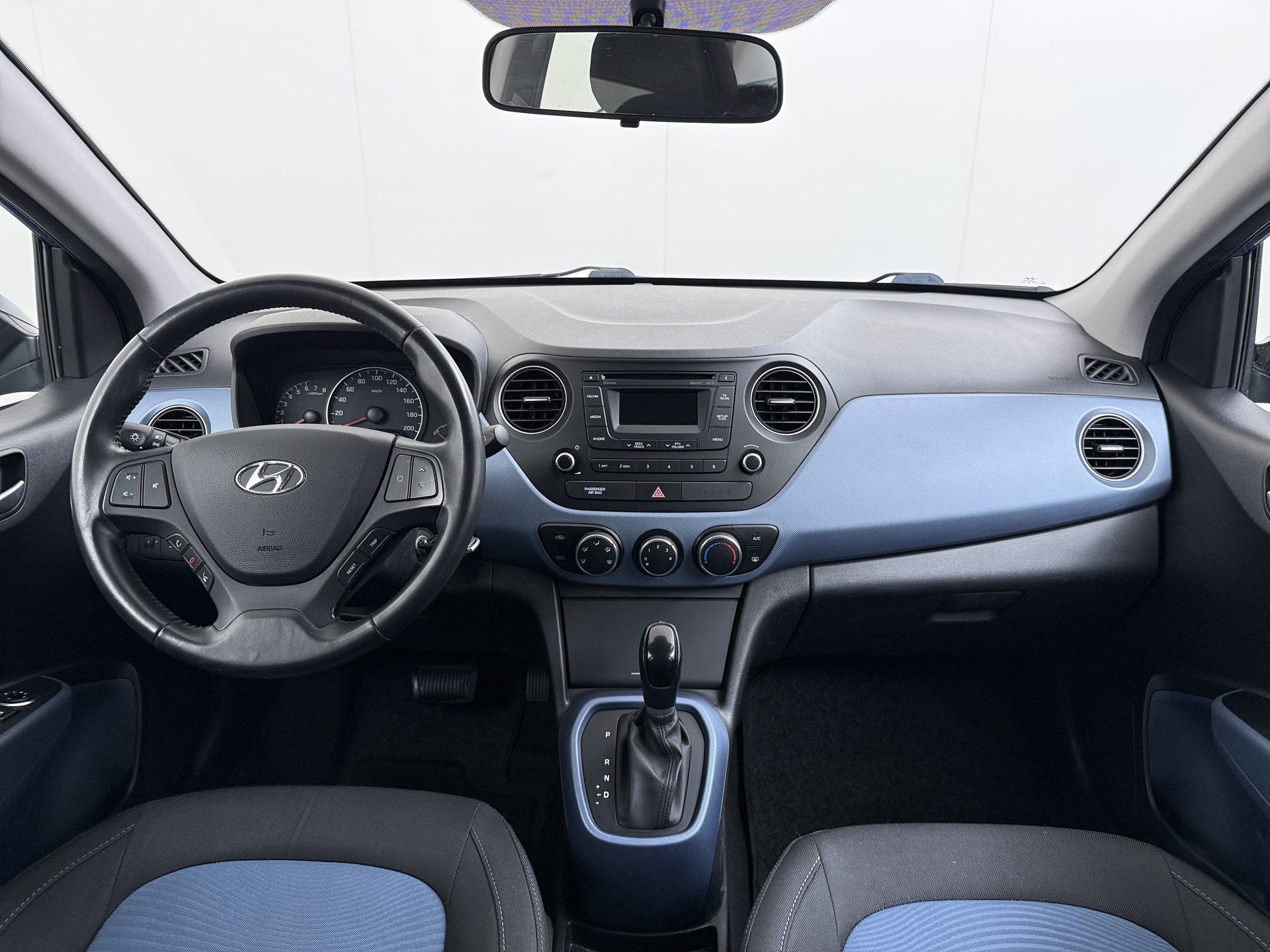 Hyundai i10 Automaat 5Drs Airco Pdc Bluetooth i-Motion Comfo, Auto's, Hyundai, Euro 5, Stof, Gebruikt, Blauw