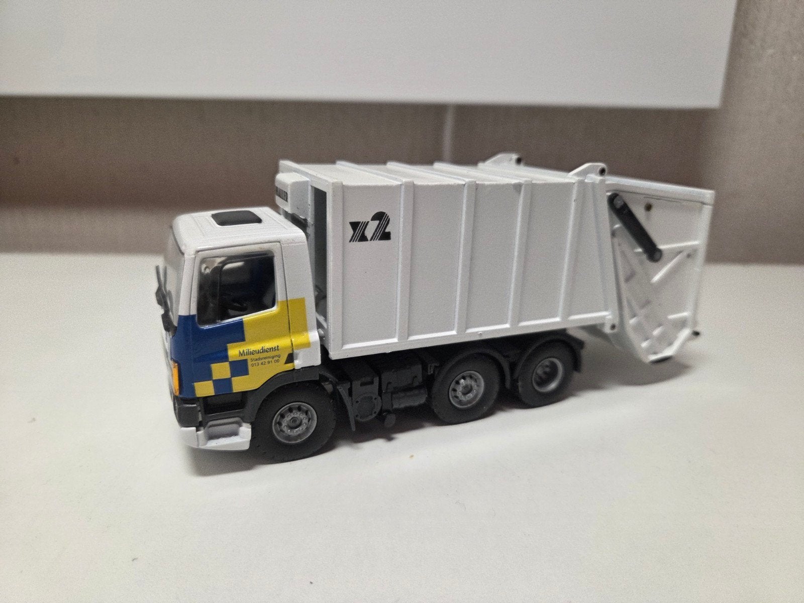 Tekno DAF 75 vuilniswagen Gemeente Tilburg, Ophalen of Verzenden, Zo goed als nieuw, Bus of Vrachtwagen, Tekno