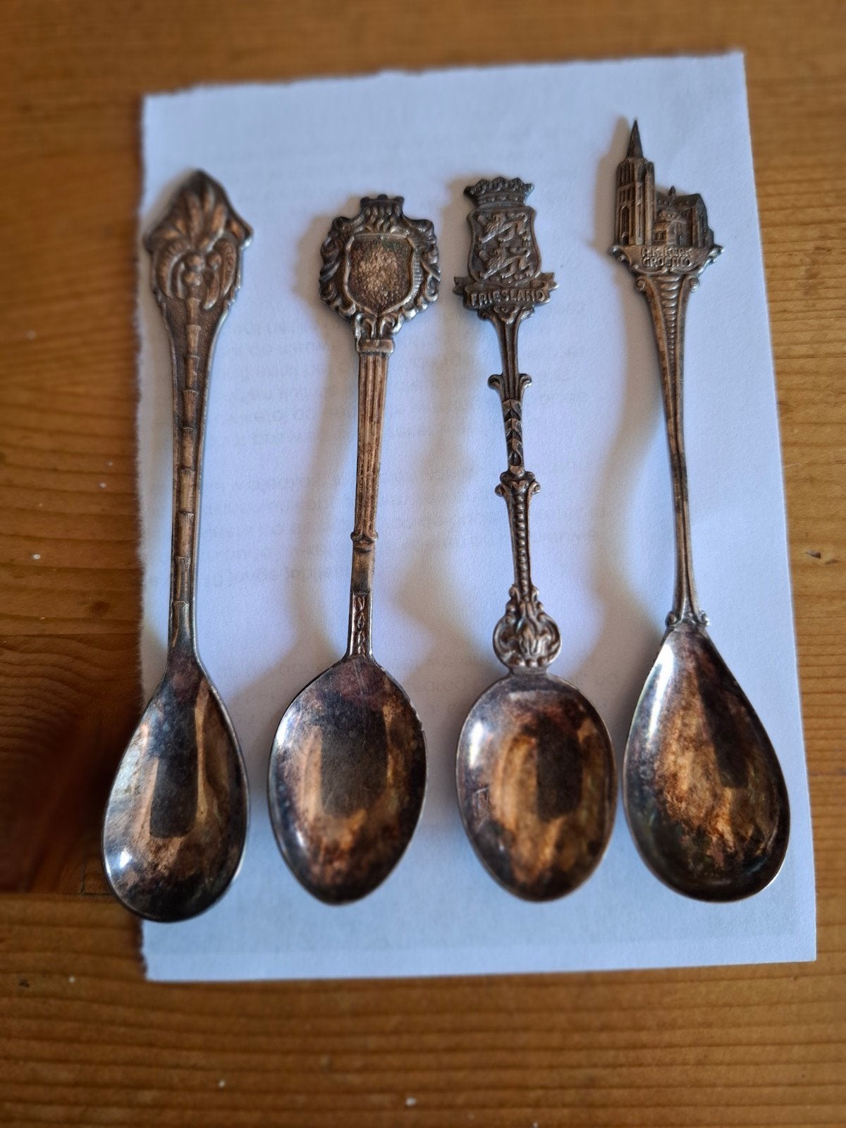 4 zilveren lepeltjes, diverse motieven, Ophalen of Verzenden