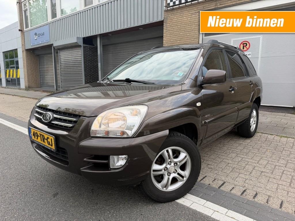 Kia SPORTAGE 2.7 V6 M-bition 4WD CLIMA HALFLEER NAP APK DIST, Auto's, Kia, Automaat, Gebruikt, Bruin, 2656 cc