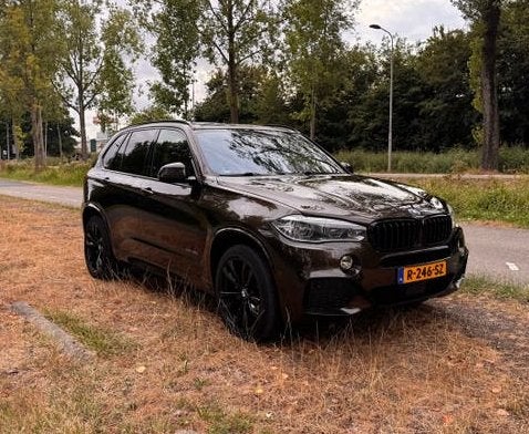 BMW X5 xDrive40e M-Sport | Individual | B&O | Pano, Auto's, BMW, 4 cilinders, Bruin, Navigatiesysteem, Bruin