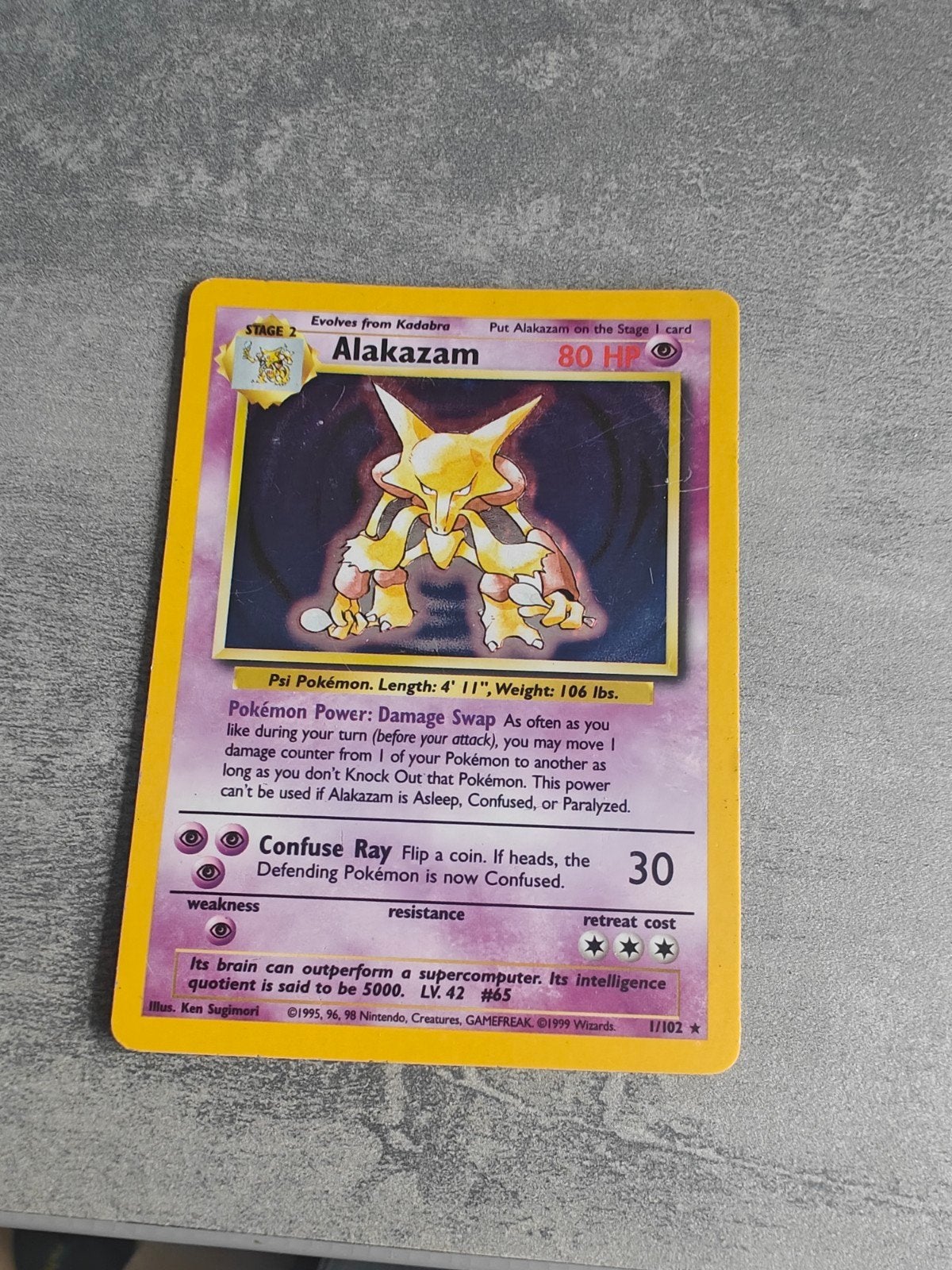 Alakazam Pokémon kaart - Base Set 1/102 (1999), Ophalen of Verzenden, Gebruikt, Losse kaart
