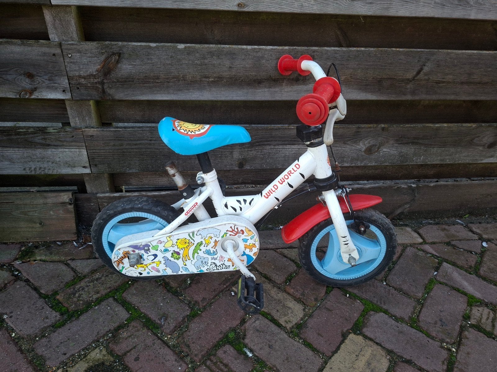 Kinderfiets Wild World - 10 inch, Ophalen, Terugtraprem, Zijwieltjes, Gebruikt