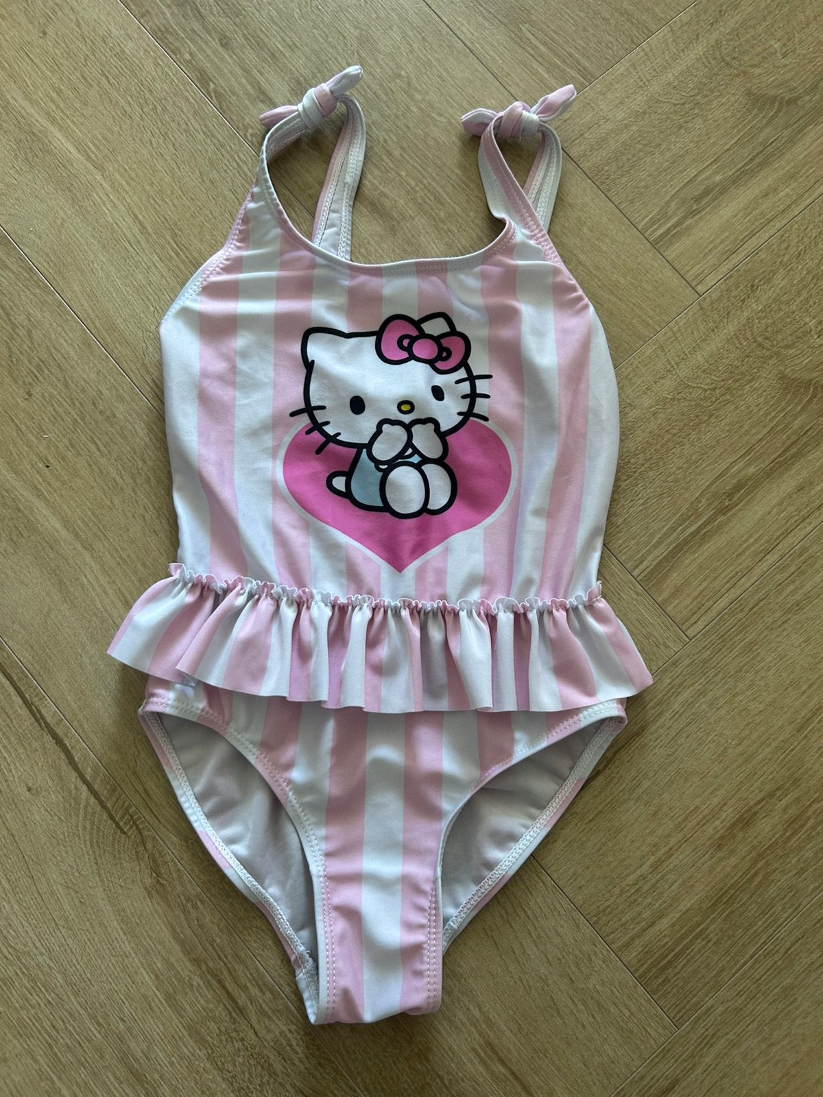 Hello Kitty meisjes badpak 122/128, Meisje, Badpak, Zo goed als nieuw, Ophalen of Verzenden