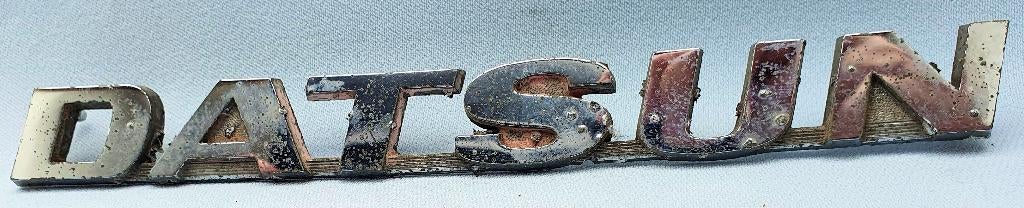 Datsun embleem 60er jaren, Verzenden, Gebruikt, Auto's
