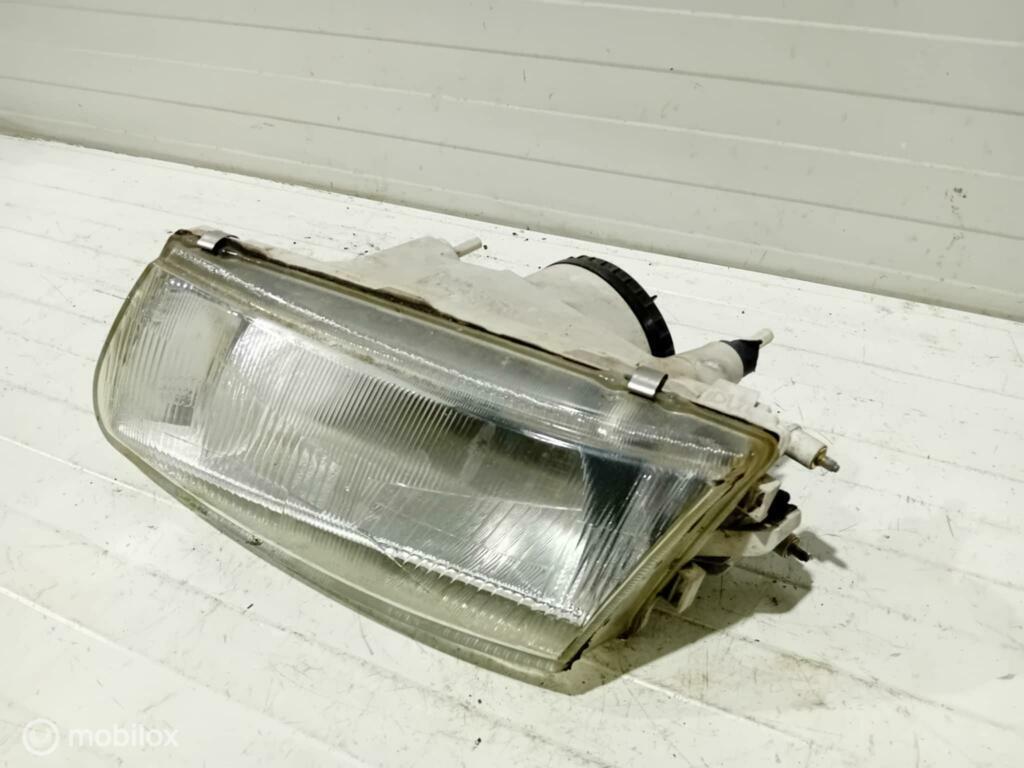 Koplamp Mitsubishi Carisma 14525900, Auto-onderdelen, Verlichting, Gebruikt, Ophalen of Verzenden