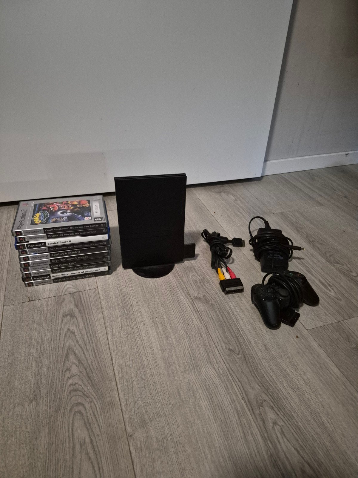 PS2 Slim met 10 games en 2 controllers, Spelcomputers en Games, Spelcomputers | Sony PlayStation 2, Verzenden, Zwart, Met 2 controllers