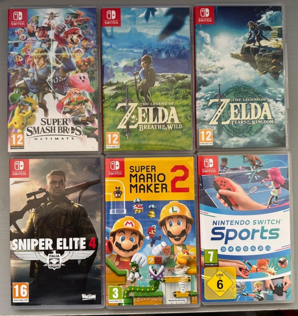 Foto 3 van Nintendo Switch Oled + 6 games