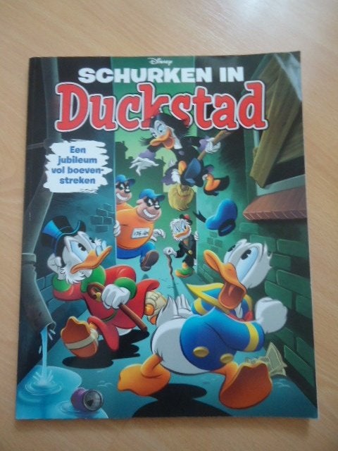 Schurken in Duckstad, een jubileum vol boevenstreken, Eén stripboek, Ophalen of Verzenden, Zo goed als nieuw