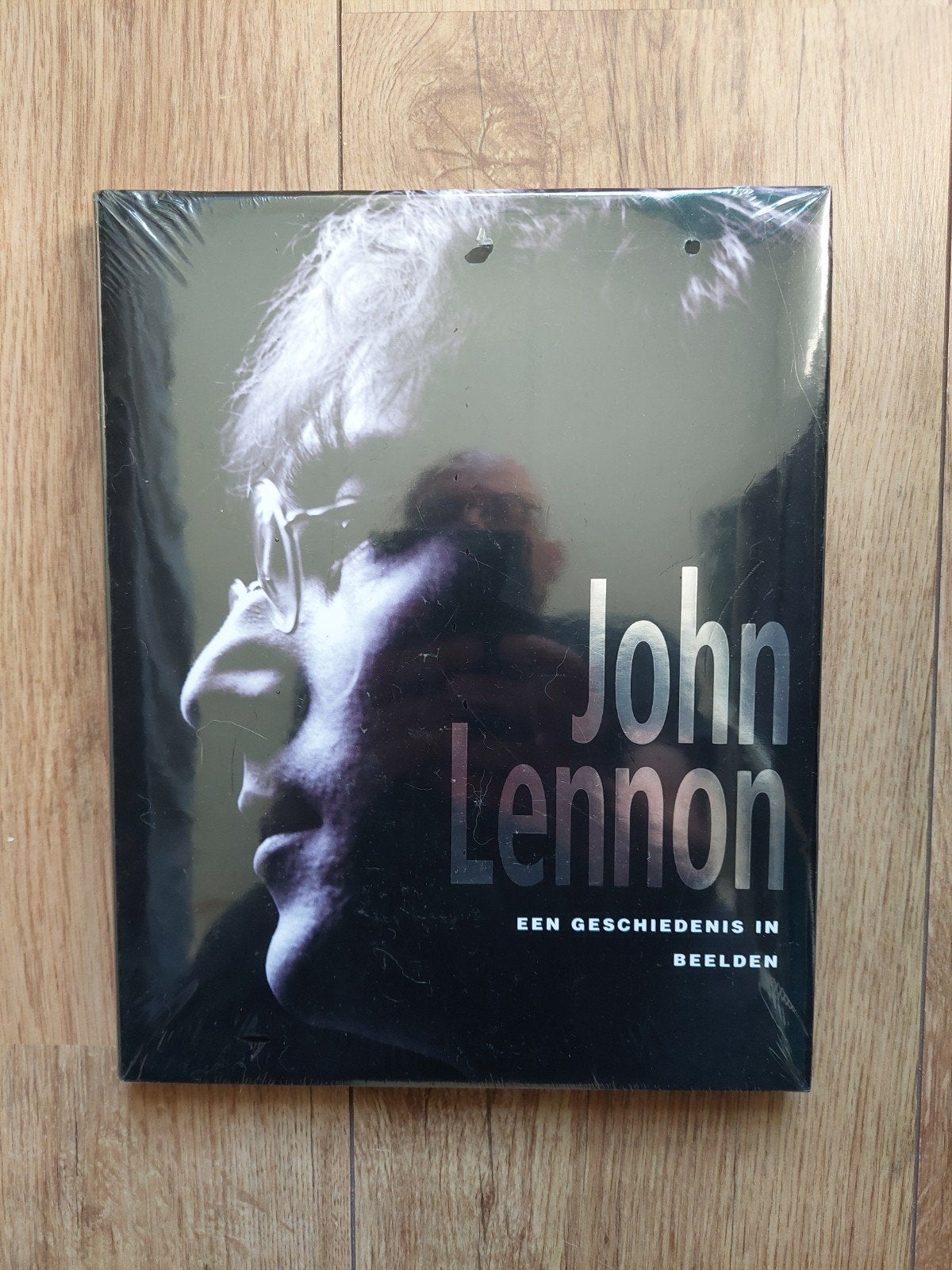 John Lennon: Een Geschiedenis in Beelden - Nieuw Boek, Boeken, Ophalen of Verzenden, Nieuw, Niet gespecificeerd op de cover, Film, Tv en Media
