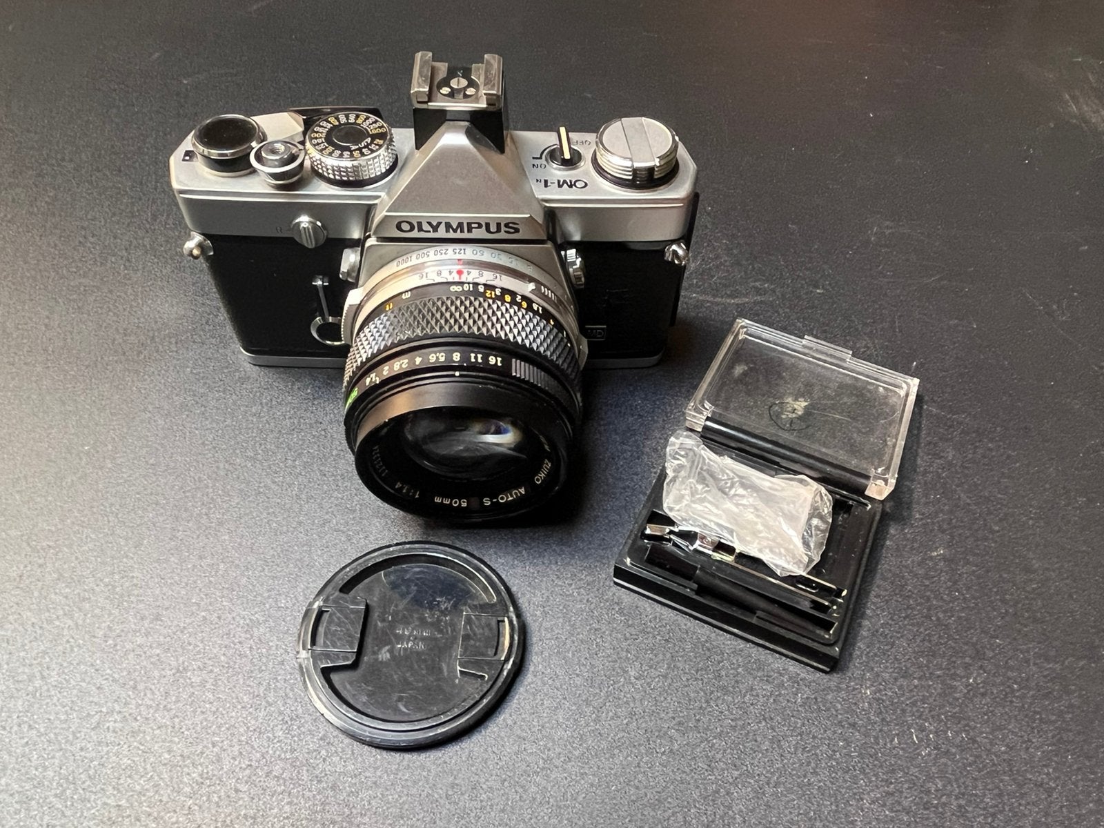 Olympus OM 1 met 50 mm f1.4 en matglas 1-12, Audio, Tv en Foto, Fotocamera's Analoog, Ophalen of Verzenden, Gebruikt, Spiegelreflex