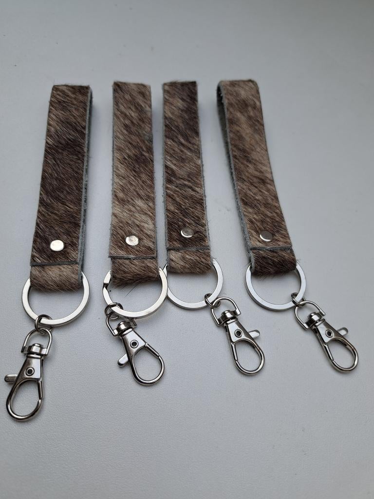 Sleutelhanger leer €1 per stuk, Verzamelen, Sleutelhangers, Verzenden