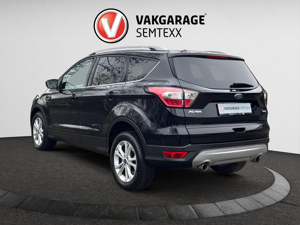 Ford Kuga 1.5 EcoBoost Titanium| Clima | Cruise | Navi | Key, Auto's, Ford, Voorwielaandrijving, 4 cilinders, Leder en Stof, Zwart