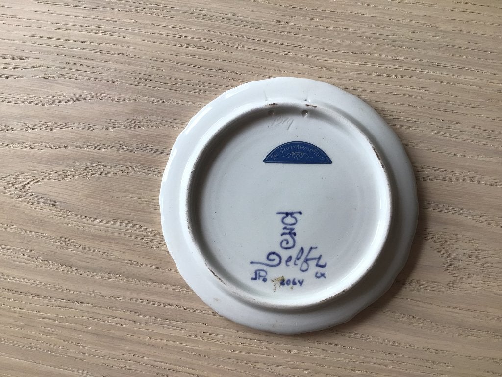 Delfts blauw bordje, Ophalen