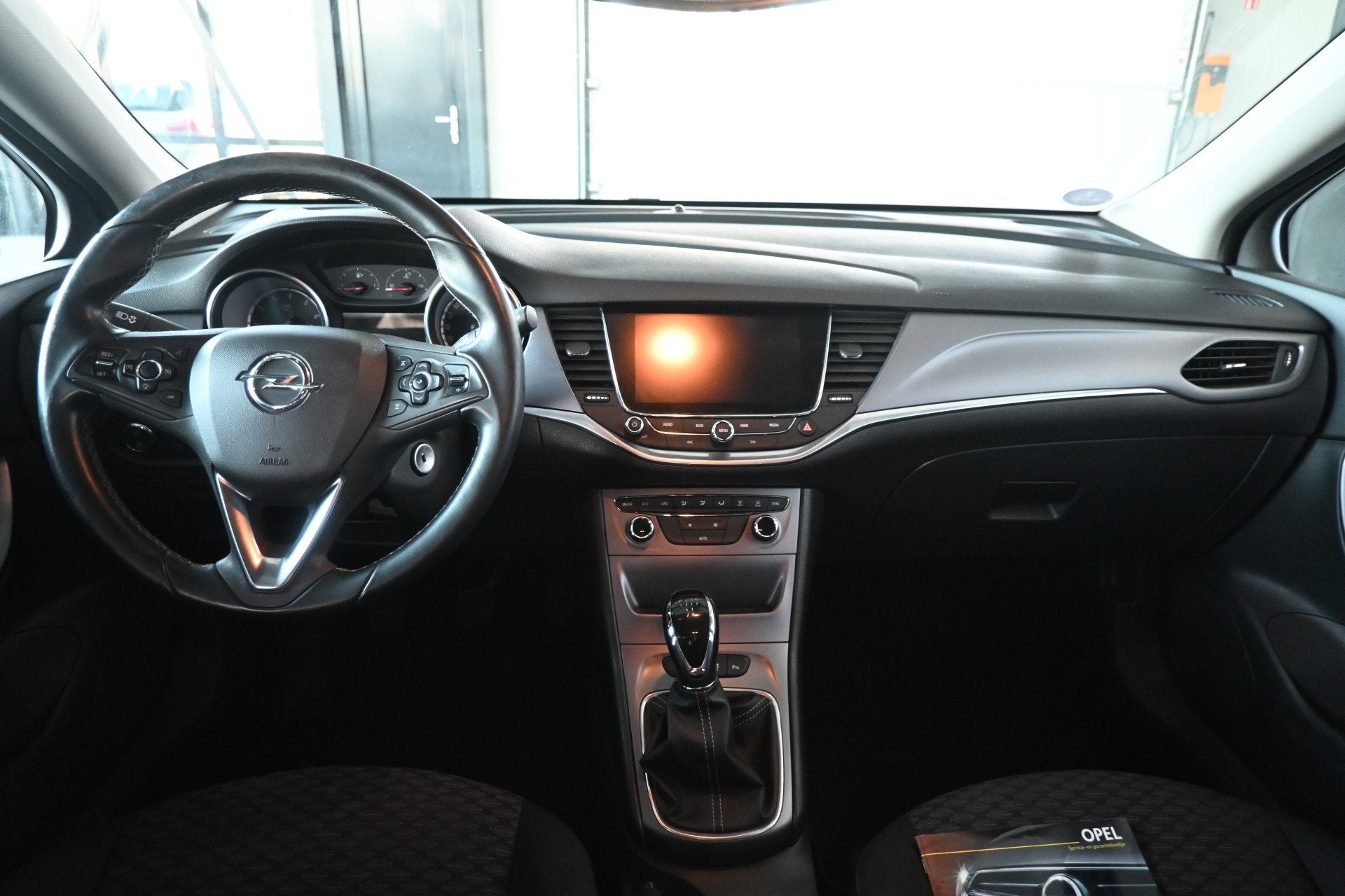 Opel Astra Sports Tourer 1.0 Business+ Clima Navigatie Carpl, Auto's, Stof, Gebruikt, 1178 kg, Met garantie (alle)