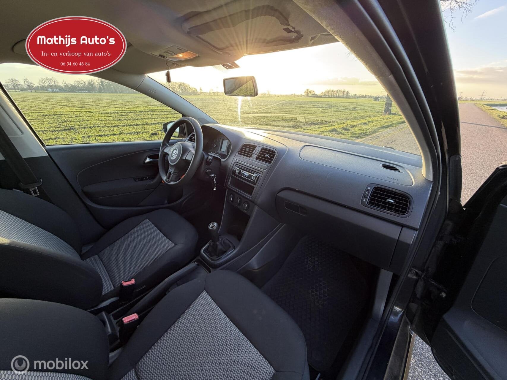 Volkswagen Polo 1.6 TDI Comfortline, Auto's, Voorwielaandrijving, Euro 5, Verwarmde buitenspiegels, Zwart