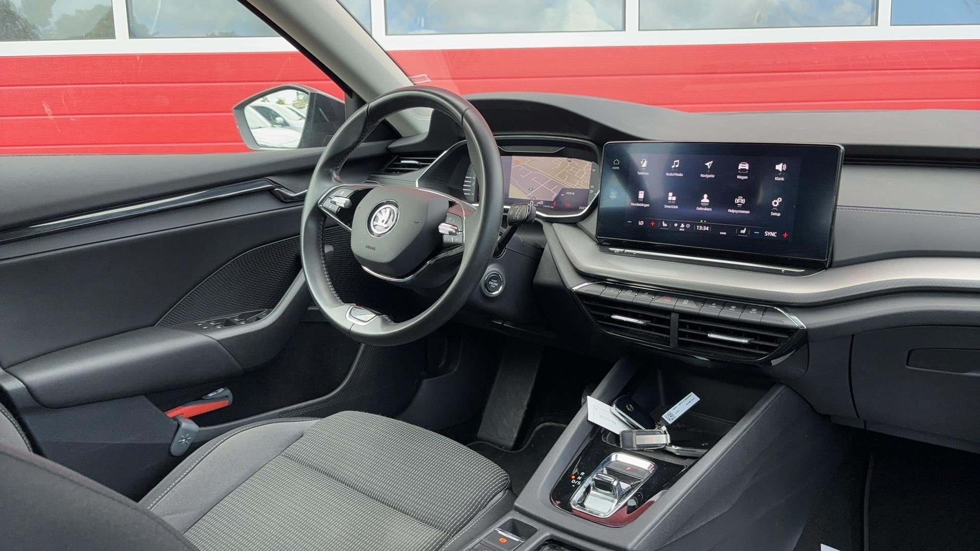 Skoda Octavia Combi 1.0 e-TSI Business Edition AUTOMAAT / ST, Auto's, Skoda, Stof, Gebruikt, Euro 6, 19 km/l