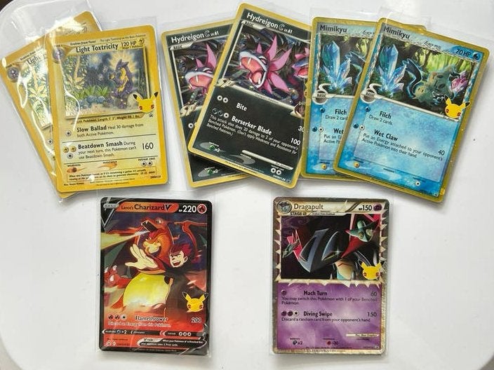 Pokémon Celebrations promo kaarten – Charizard & meer, Hobby en Vrije tijd, Verzamelkaartspellen | Pokémon, Verzenden, Nieuw, Meerdere kaarten