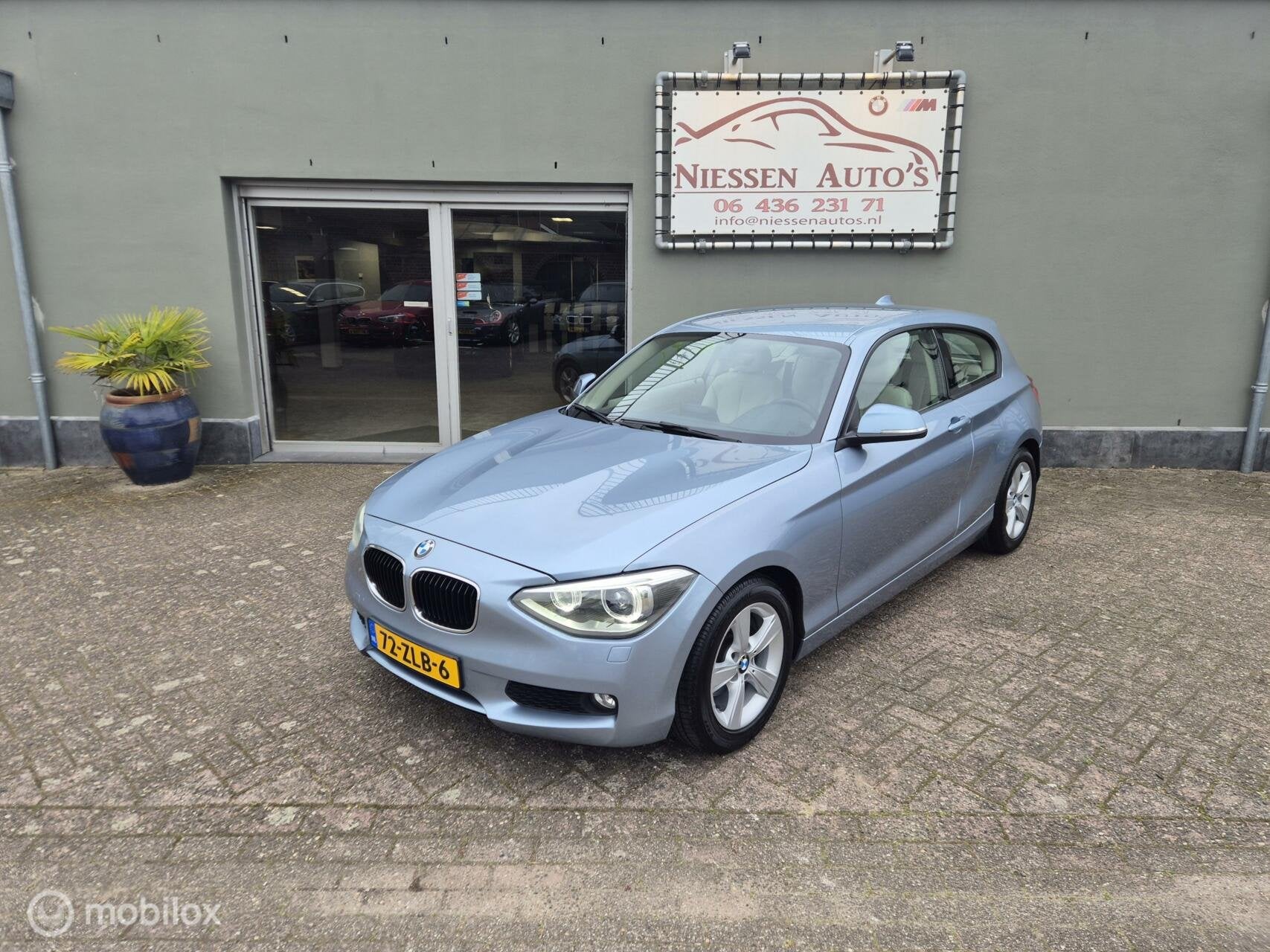 BMW 1-serie F21 114i Business+ Navi/Leder/Ketting Vervangen, Auto's, BMW, 1-Serie, Euro 5, Achterwielaandrijving, Beige