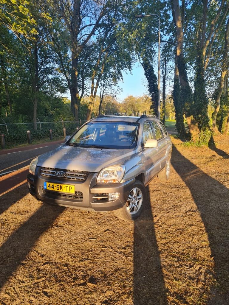 Kia Sportage 2.0 2WD 2006 Grijs, Auto's, Kia, 1442 kg, Zwart, 4 cilinders, Leder en Stof