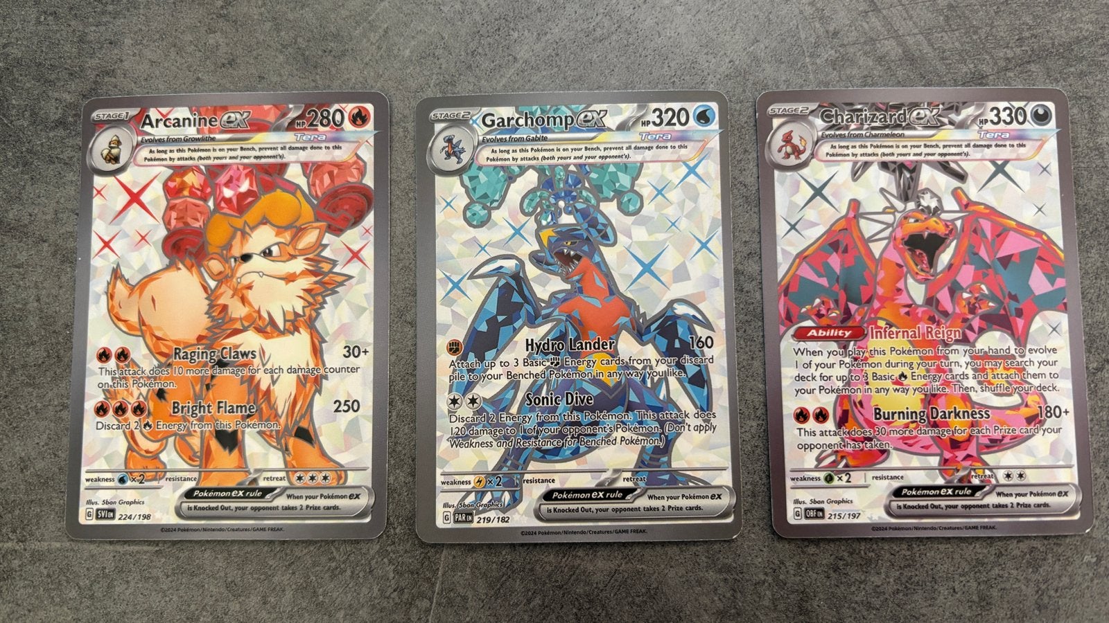 Pokémon TCG: Arcanine, Garchomp, Charizard ex (Foil), Ophalen of Verzenden, Zo goed als nieuw, Meerdere kaarten, Foil