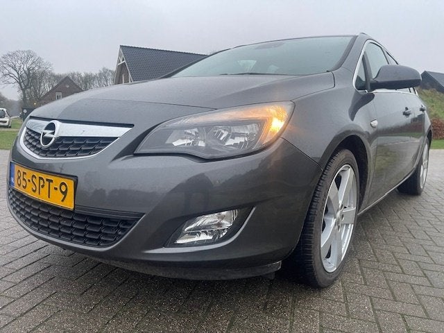 Opel Astra Sports Tourer 1.4 Turbo Edition (bj 2011), Auto's, Voorwielaandrijving, Euro 5, Stof, Gebruikt