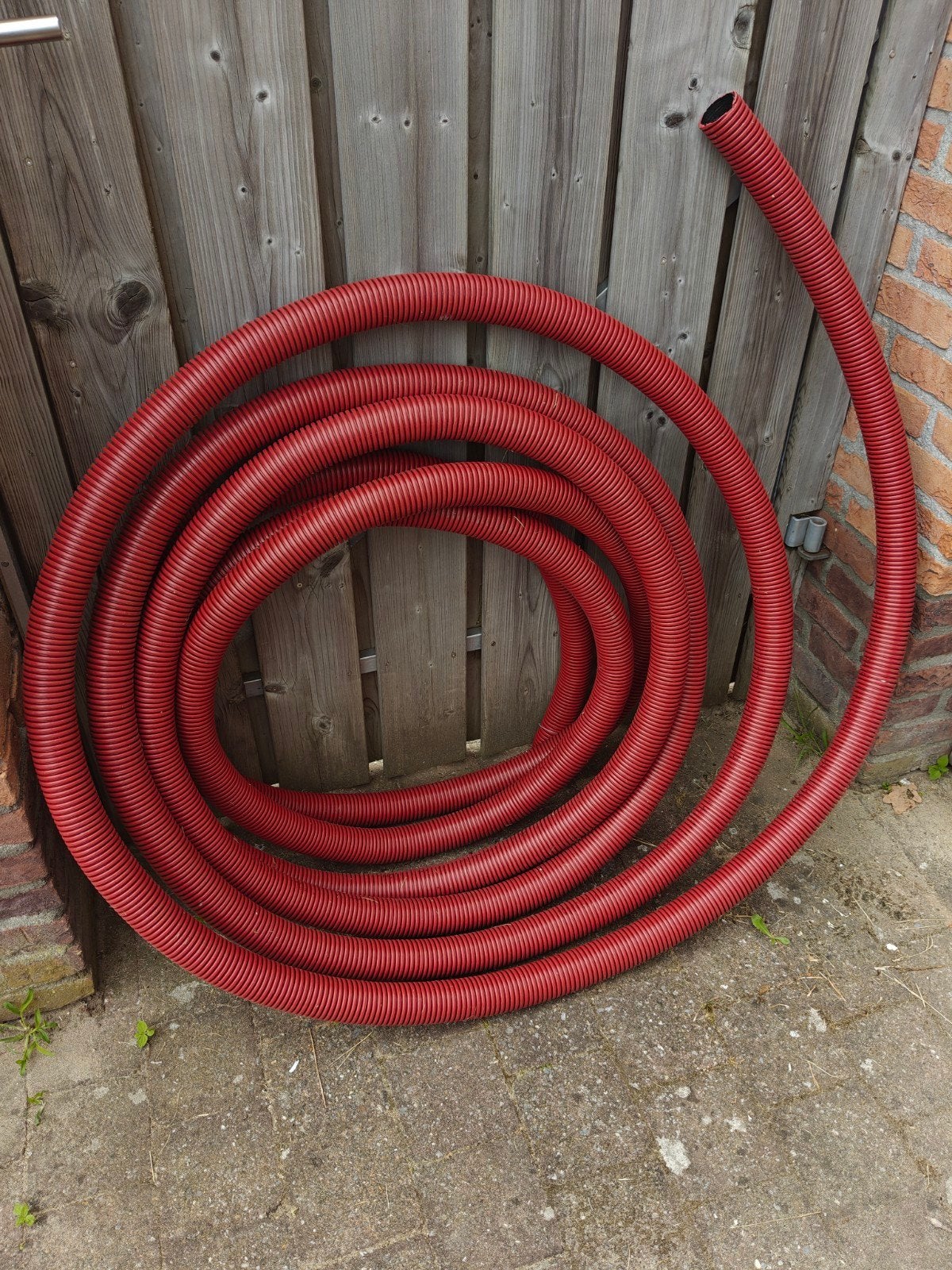 Rode mantelbuis Ø50 mm – ca. 12 meter – nieuw/ongebruikt, Ophalen of Verzenden, Zo goed als nieuw