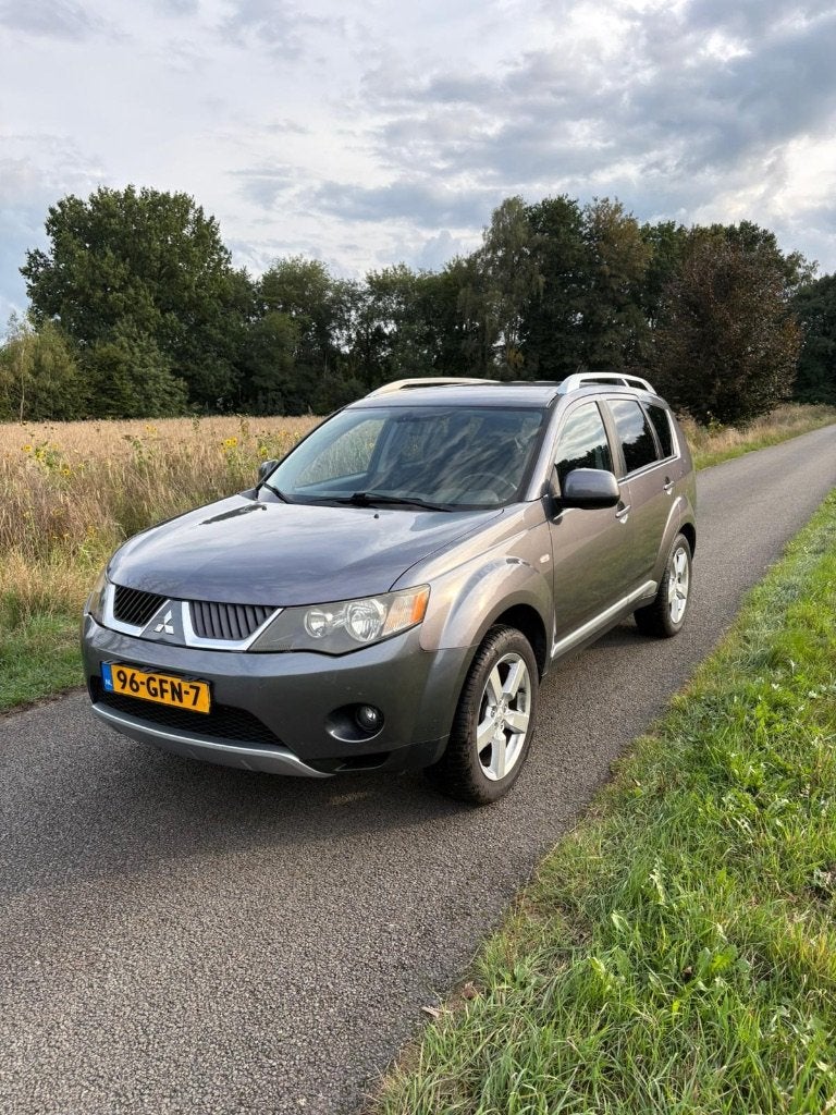 Mitsubishi Outlander 2.4 MPI 4WD CVT 2008 Grijs, Auto's, Automaat, Stof, Outlander, Zwart