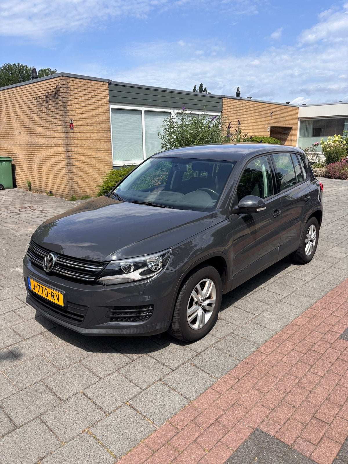 Volkswagen Tiguan 1.4 TSI 92KW 2015 Grijs, Auto's, Volkswagen, Voorwielaandrijving, 125 pk, 4 cilinders, Handgeschakeld