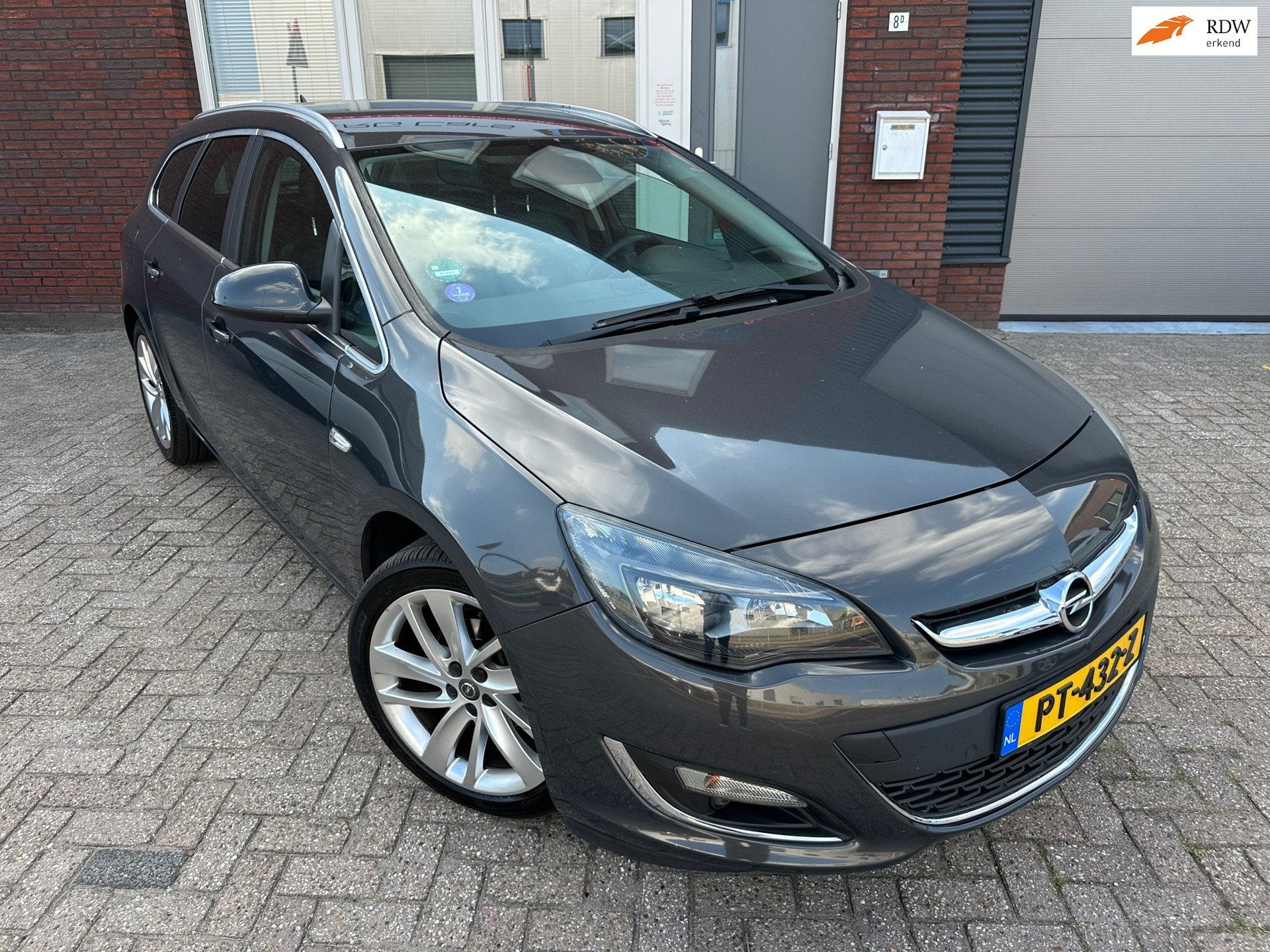 Opel Astra Sports Tourer 1.4 Turbo Sport / Navi / Leder / Ca, Auto's, Voorwielaandrijving, Euro 5, Gebruikt, 4 cilinders