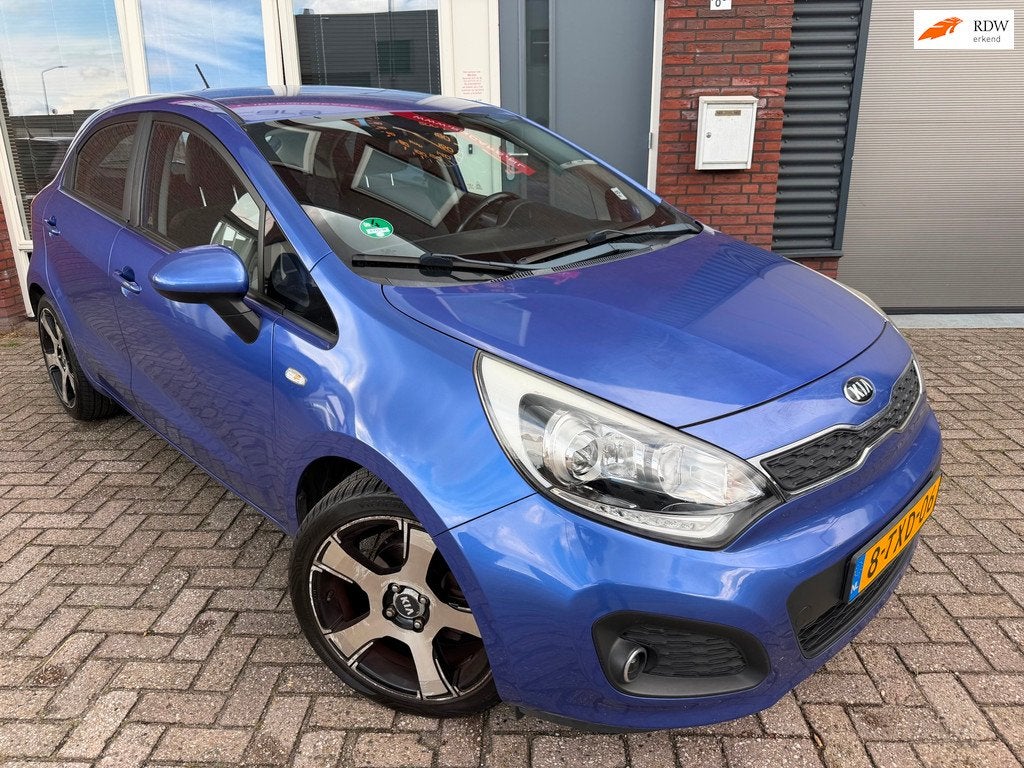 Kia Rio 1.2 CVVT BusinessLine / Airco / 5DRS / Cruise / AUX, Auto's, Kia, 4 cilinders, Met garantie (alle), Blauw, Origineel Nederlands