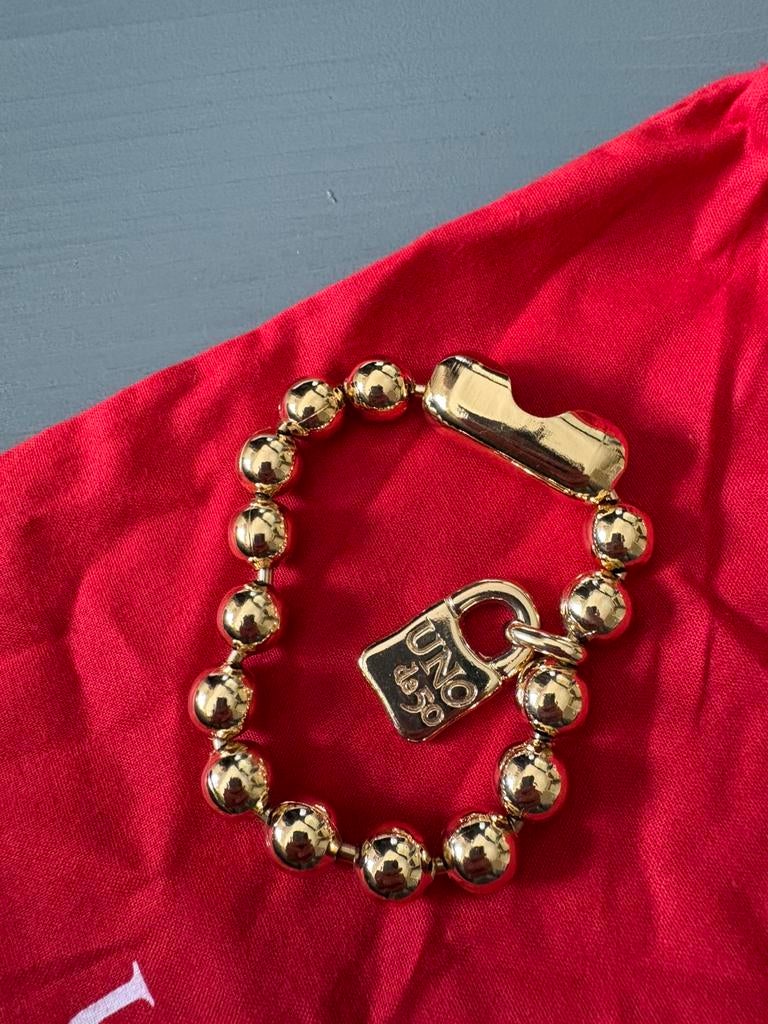 Uno de 50 armband goud, Sieraden, Tassen en Uiterlijk, Armbanden, Ophalen of Verzenden, Zo goed als nieuw, Goud, Staal