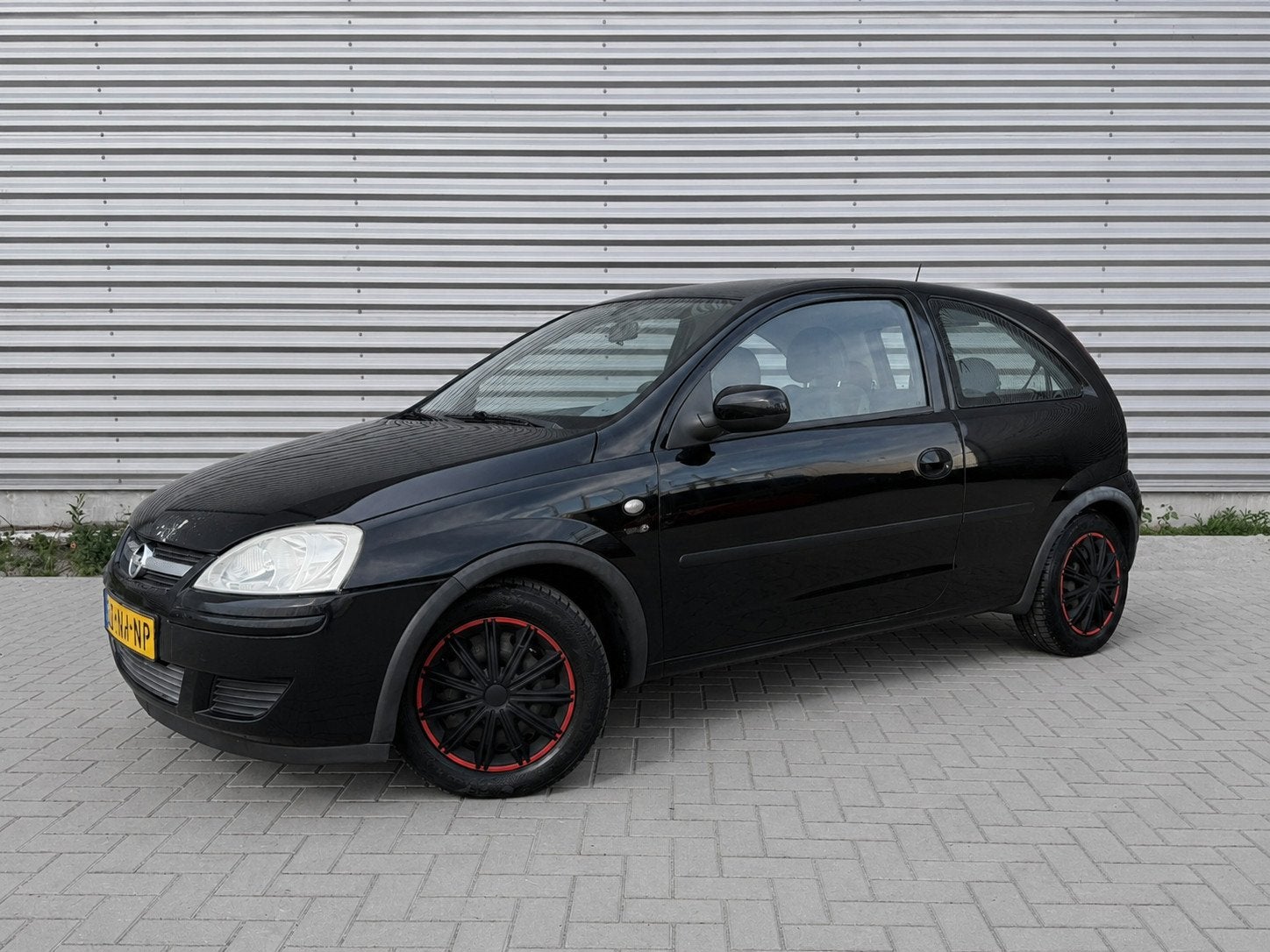 Opel Corsa 1.2-16V Cosmo, Auto's, Voorwielaandrijving, Gebruikt, Zwart, Origineel Nederlands