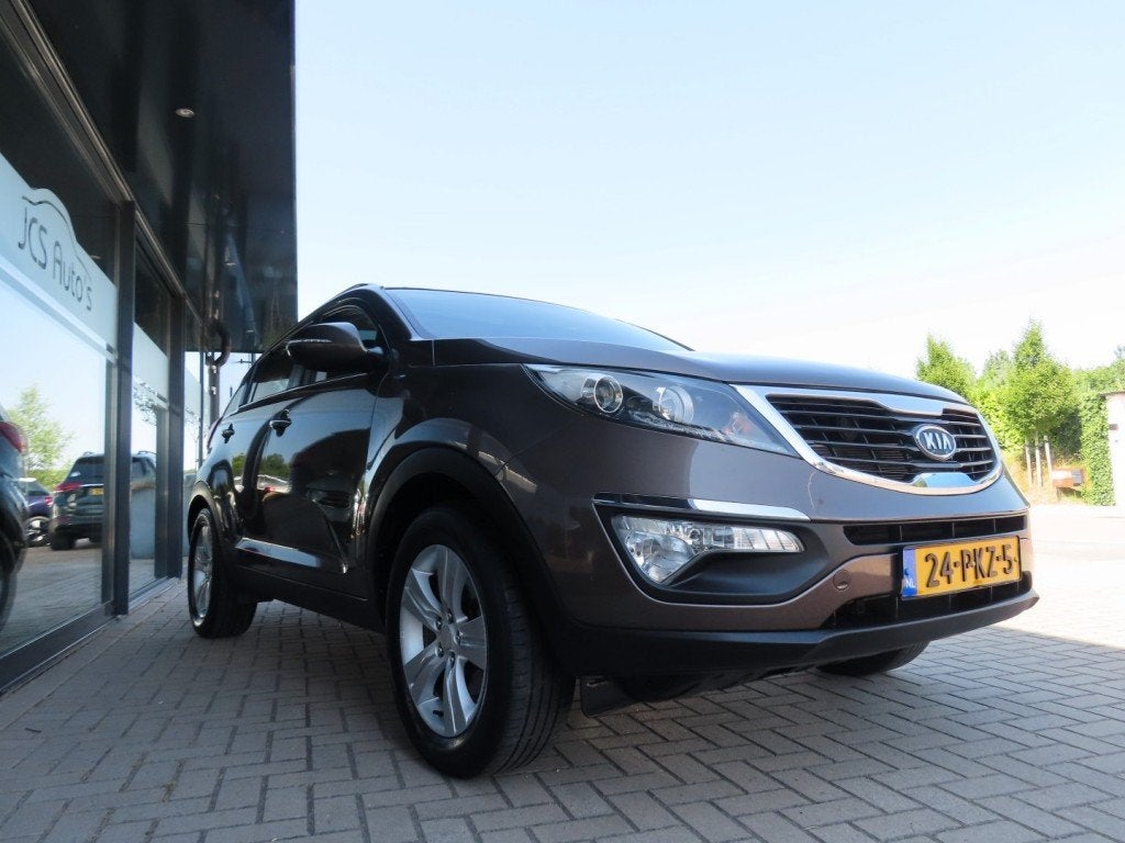 Kia SPORTAGE 2.0 X-ECUTIVE Plus Ecc Cruise Pano Trekhaak 201, Auto's, Gebruikt, 4 cilinders, Bruin, 163 pk
