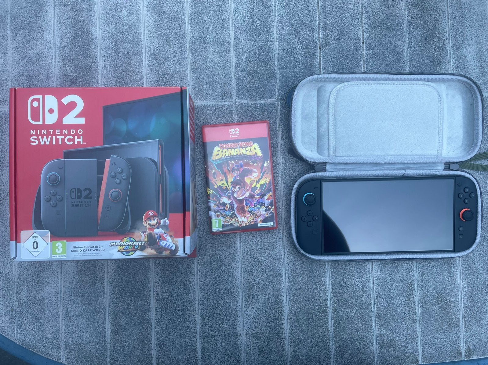 Nintendo Switch 2 Mario kart world + donkey kong bananza, Ophalen, Zo goed als nieuw, Hoesje, Tasje of Behuizing