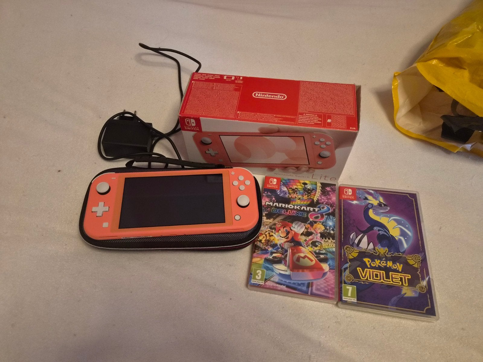Nintendo Switch Lite compleet pakket, Ophalen, Roze of Coral, Zo goed als nieuw, Met beschermhoes of tas