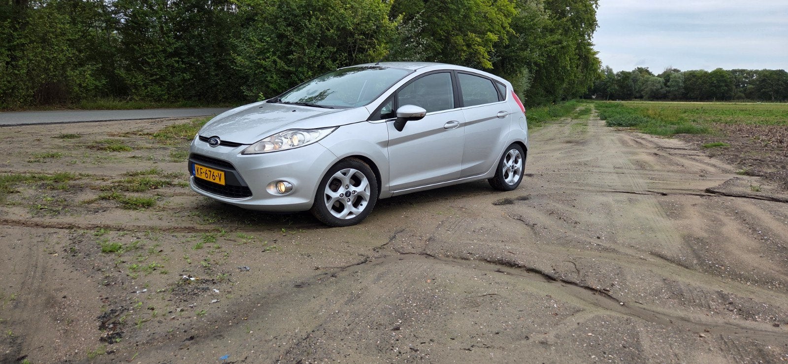 Ford Fiësta 1.25 60KW 5DR 2011 Grijs, Auto's, Voorwielaandrijving, Elektrische ramen, Stof, Handgeschakeld