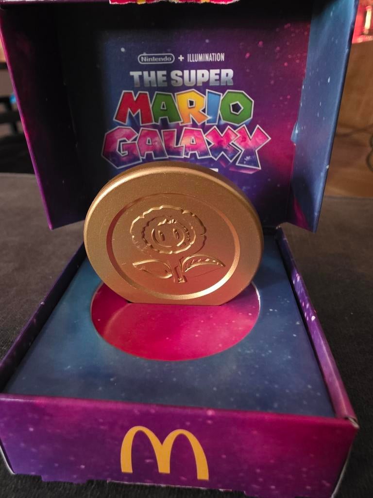 McDonald's Super Mario Galaxy munt (ruilen voor ster/ei), Ophalen of Verzenden, Zo goed als nieuw