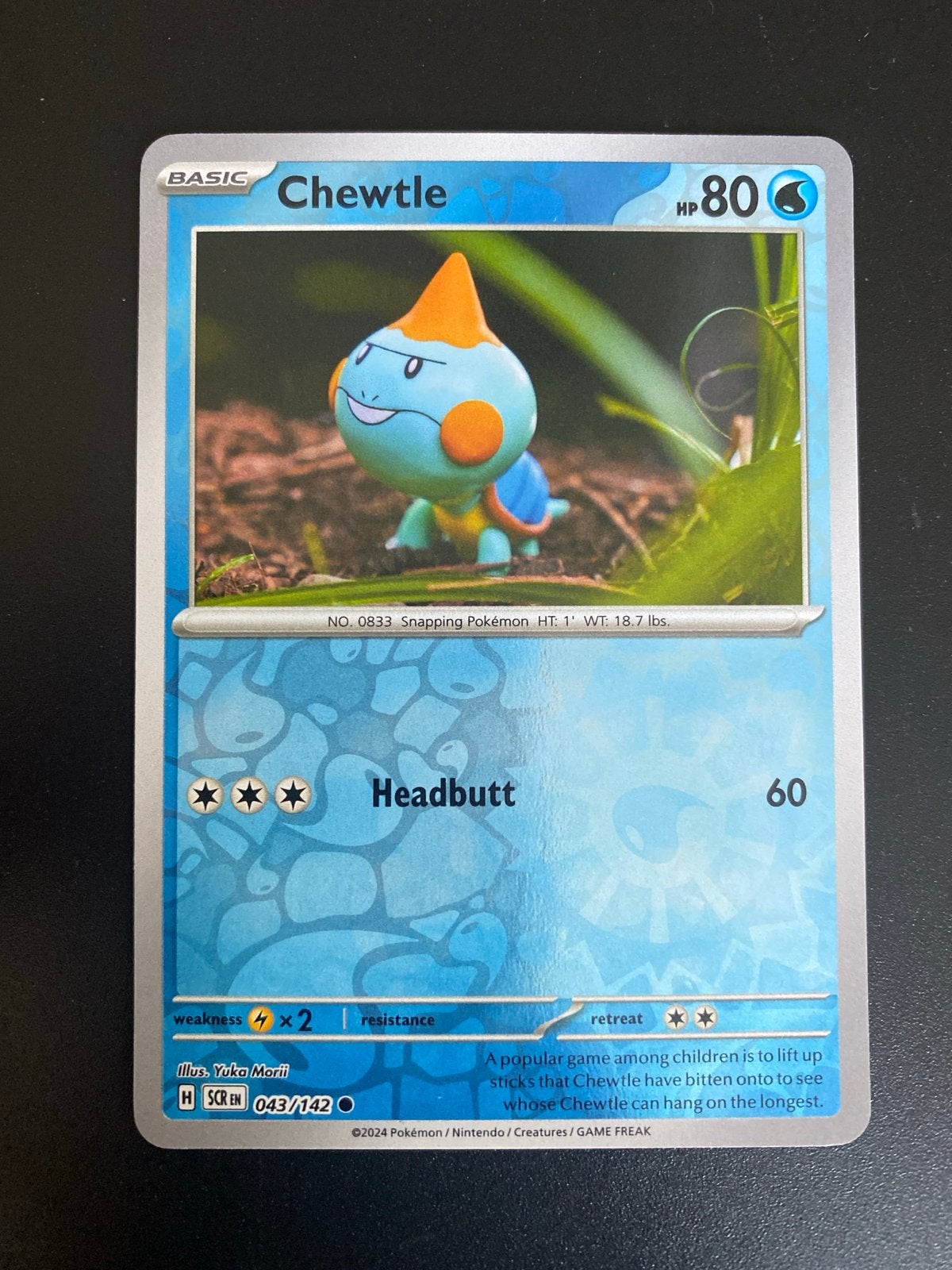 Chewtle 043/142 Reverse Holo Pokémon Stellar Crown, Hobby en Vrije tijd, Verzamelkaartspellen | Pokémon, Zo goed als nieuw, Losse kaart