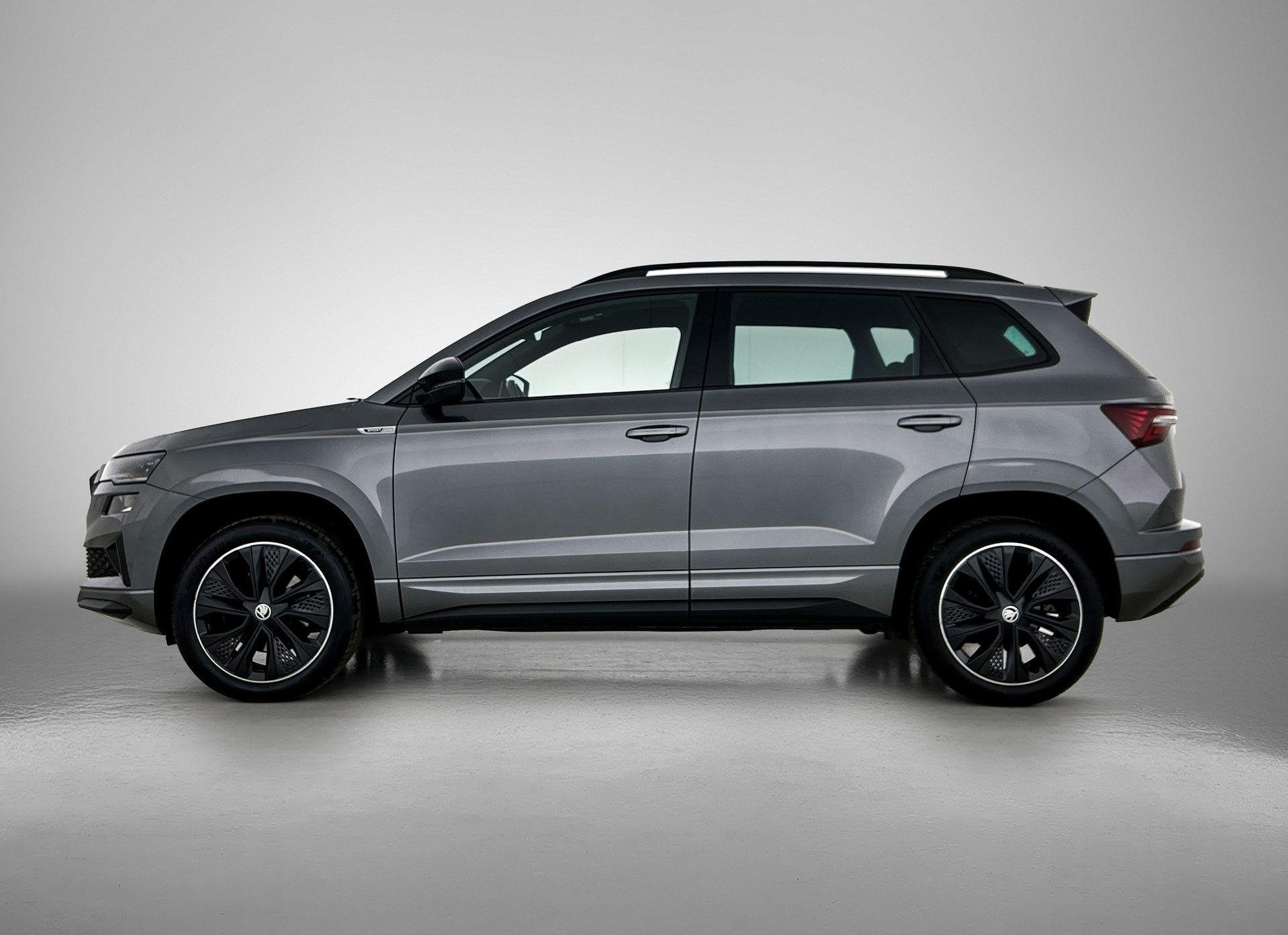 Skoda Karoq 1.5 TSI ACT Sportline Business | ACHTERUITRIJCAM, Auto's, Stof, 4 cilinders, 1299 kg, Bedrijf