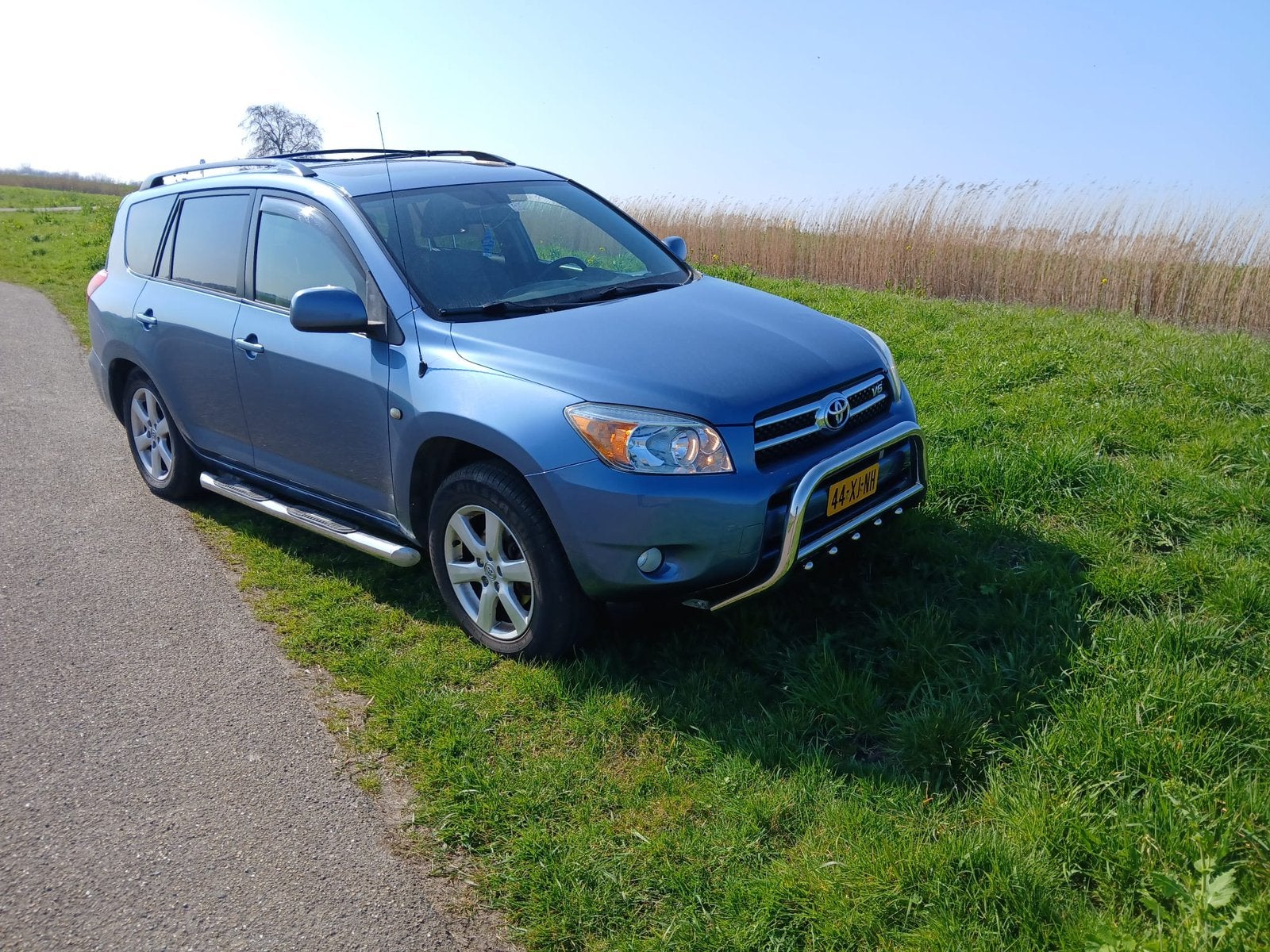 Toyota Rav4 3.5 V6 Limited Edition, Auto's, Blauw, 7 stoelen, Origineel Nederlands, Stationwagon