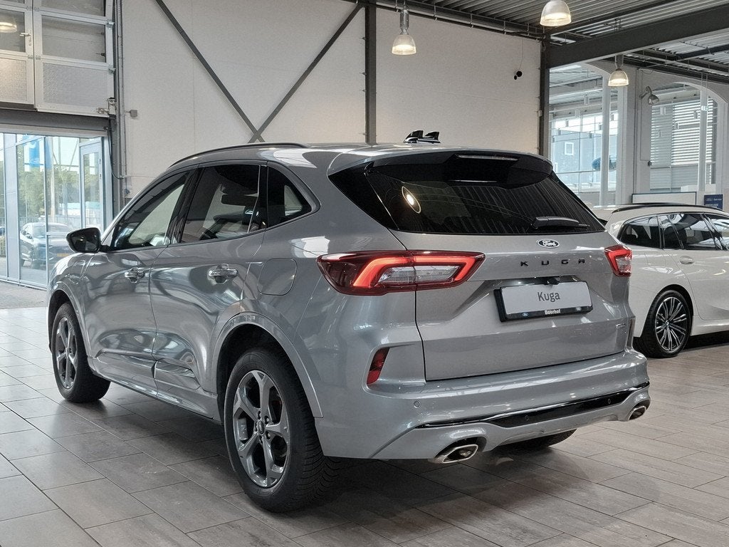 Ford Kuga 2.5 PHEV 243 pk ST-Line X I AGR stoelen | Adapt Cr, Auto's, Ford, 12 maanden, 14 kWh, Gebruikt, Zwart
