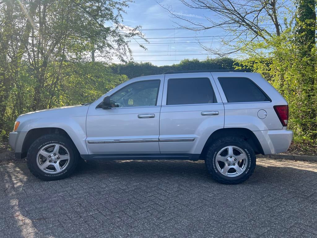 Jeep Grand Cherokee limited 2005 Grijs, Auto's, Automaat, 138 €/maand, 4701 cc, Vierwielaandrijving