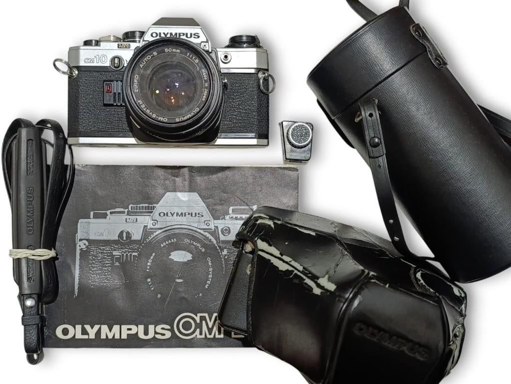 Olympus OM-10 analoge camera met 50mm lens, handleiding., Ophalen of Verzenden, Zo goed als nieuw, Spiegelreflex, Olympus