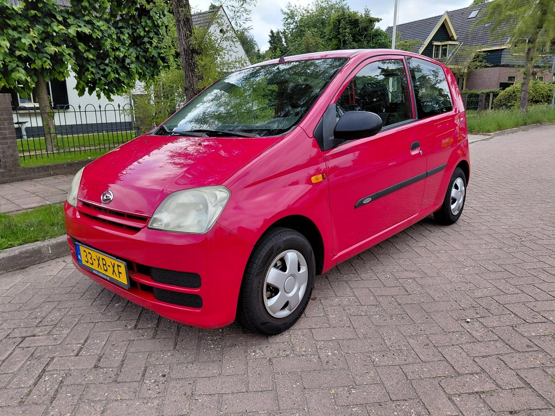 Daihatsu Cuore 1.0-12V Osaka, Auto's, Daihatsu, Voorwielaandrijving, Stof, Zwart, 4 stoelen