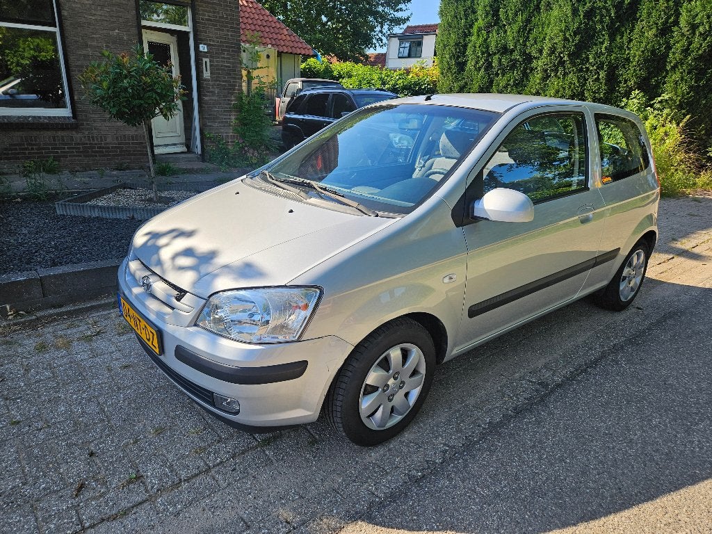 Hyundai Getz 1.3 3DRS 2004 Grijs 71.878 km Airco, Auto's, Hyundai, Voorwielaandrijving, 40 €/maand, Zwart, 4 cilinders