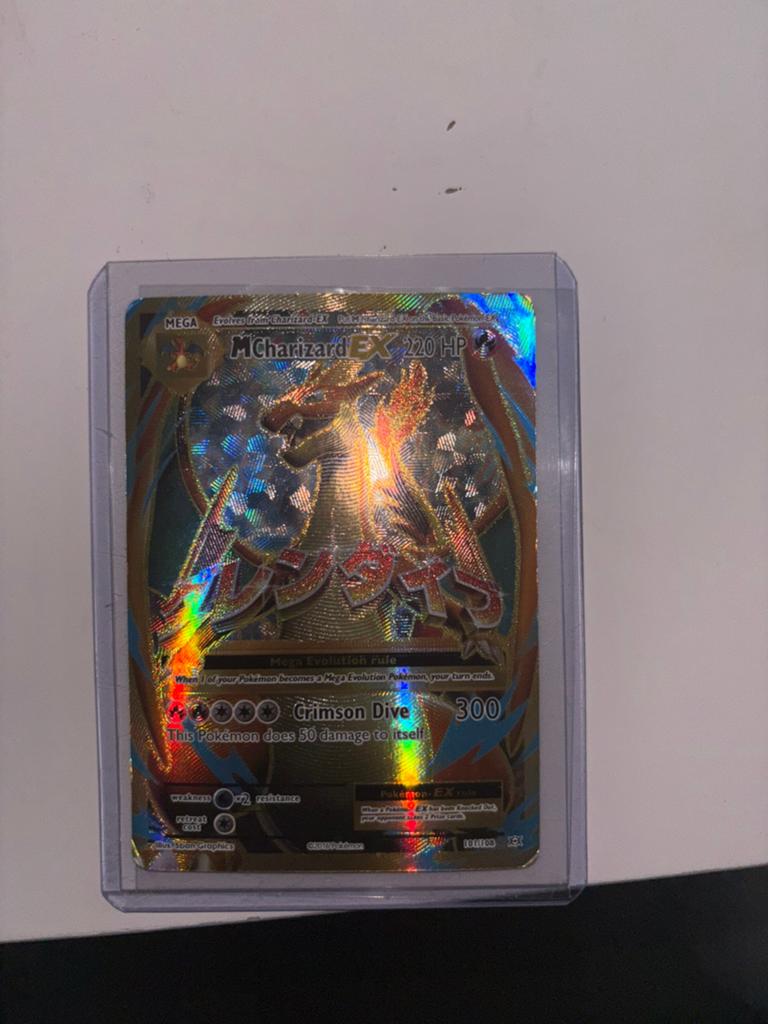 M Charizard EX, Ophalen of Verzenden, Zo goed als nieuw, Losse kaart, Foil