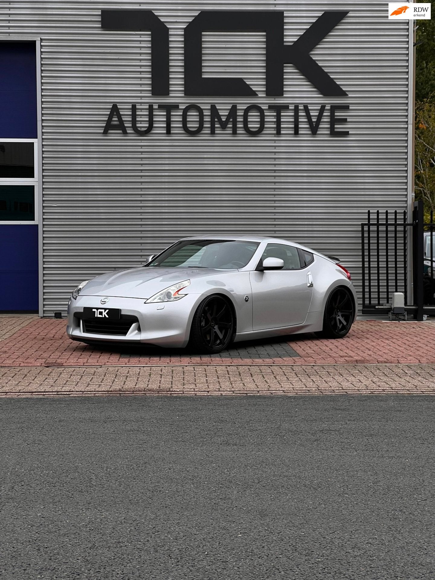 Nissan 370Z 3.7 V6 328PK/BOSE/HANDBAK/20INCH/NAVI/CAMERA, Auto's, Achterwielaandrijving, Gebruikt, Zwart, 10 km/l