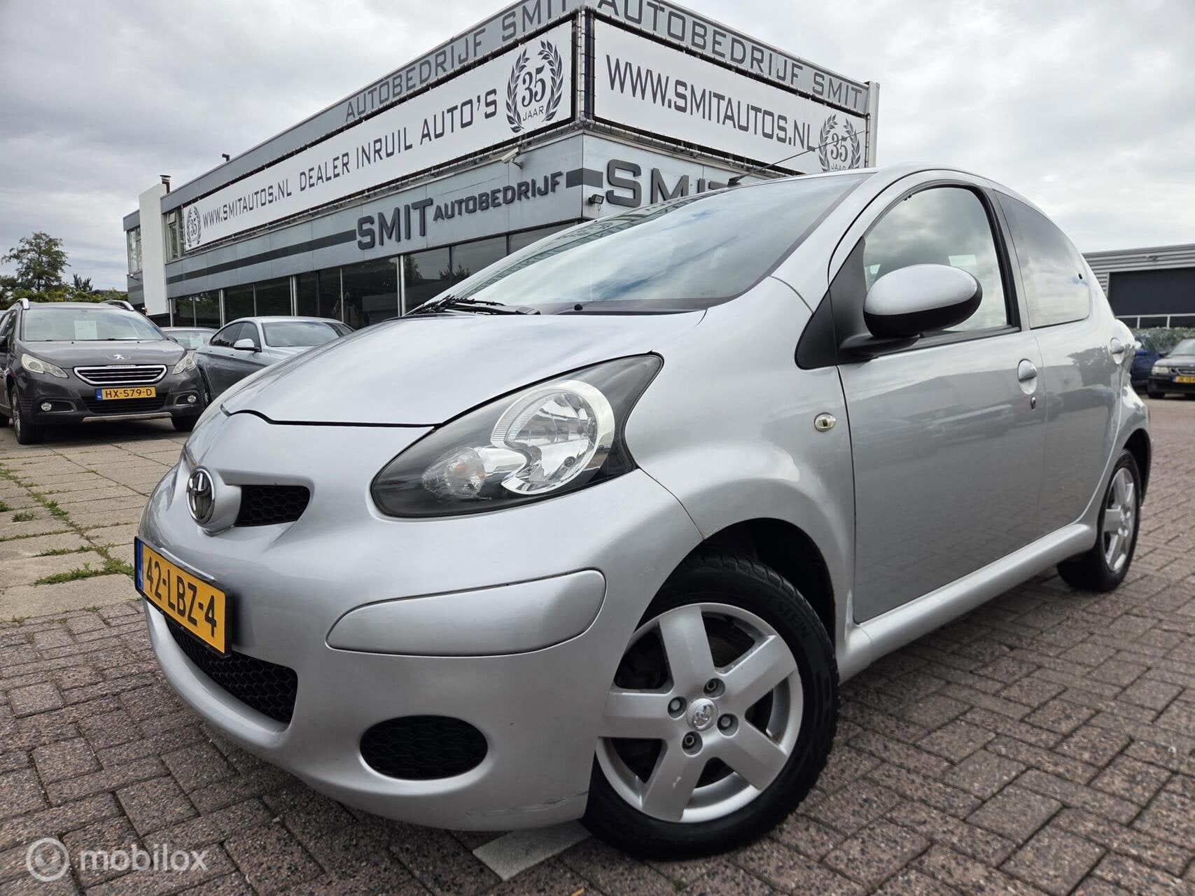 Toyota Aygo 1.0-12V Comfort 5DRS / NLAuto, Voorwielaandrijving, Stof, Gebruikt, Zwart